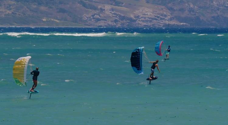 Green Hat Kiteboarding-Duotone Stash Parawing-Action Shot-Man Parawinging a Stash on the Blue Ocean