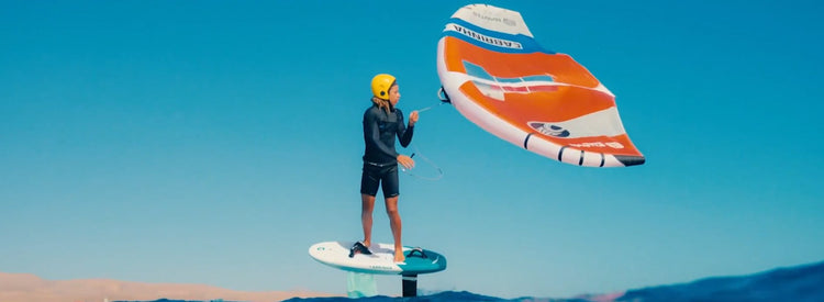 Green Hat Kiteboarding-WingFoiling Accessories Collection-2025 Cabrinha Mantis being Held by the Wing Leash