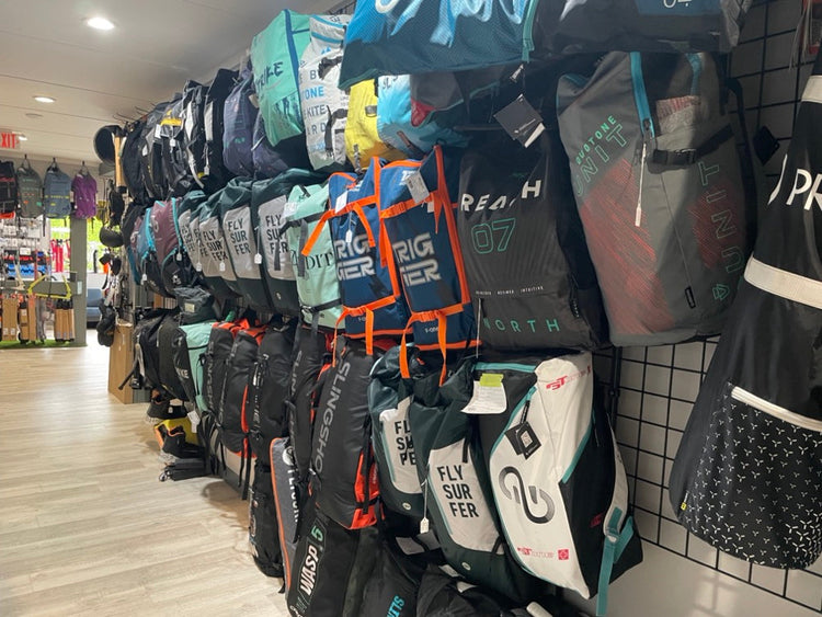 Green Hat Kiteboarding-Colleciton-Used Kites-Used Kite Wall in Green Hat Shop in  NJ