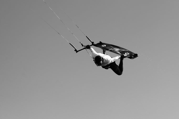 Green Hat Kiteboarding-Kiter in the air on a Duotone Kiteboard