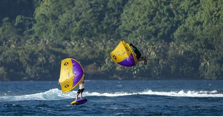 Green Hat Kiteboarding-2024 Duotone Unit D/LAB-2 wingers on a lake winging-one is jumping the other foiling