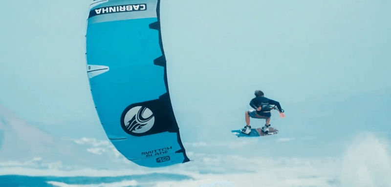 Load image into Gallery viewer, Green Hat Kiteboarding-2025 Cabrinha Switchblade Apex Kite-Action Shot of a Handle pass on the Cabrinha Switchblade APEX Kite