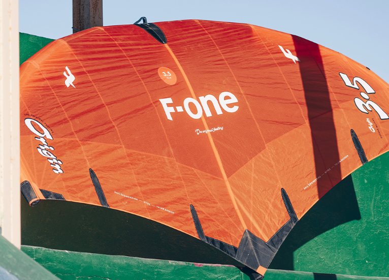 Load image into Gallery viewer, Green Hat Kireboarding-2025 F-One Origin V2-Action Shot-Inflated Wing Drying on a Wall