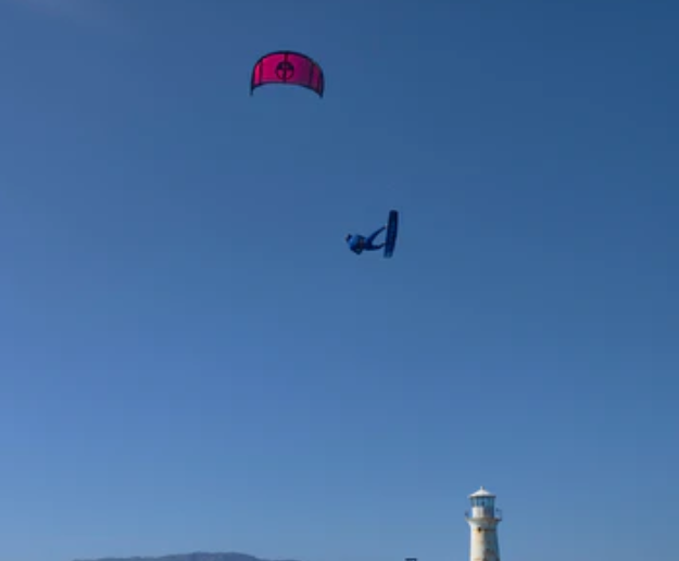 Load image into Gallery viewer, Green Hat Kiteboarding-2025 North Orbit-Action Shot-Man in the Air Riding a Rubine Red North Orbit