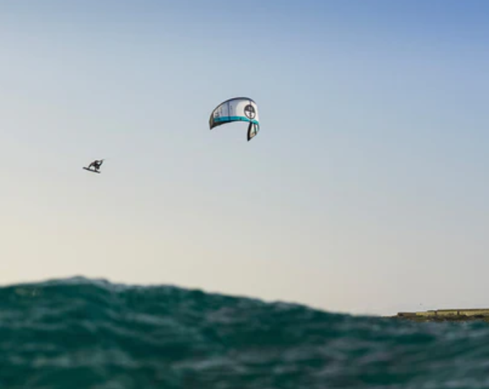 Load image into Gallery viewer, Green Hat Kiteboarding-2025 Orbit Pro-Action Shot-Man in the Air on an Orbit Pro