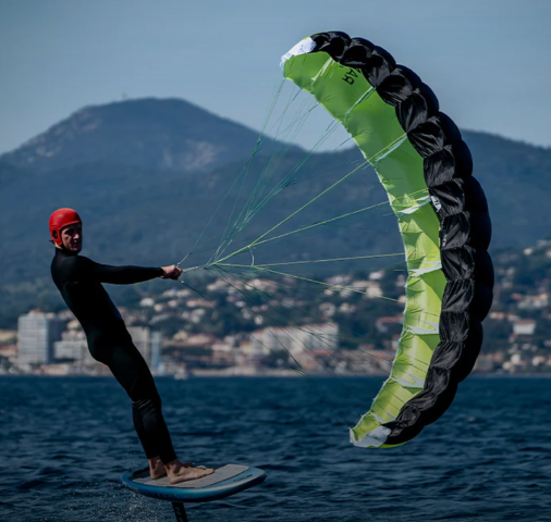 Green Hat Kiteboarding-North Ranger Parawing-Action Shot-Man on Foil with Ranger Parawing