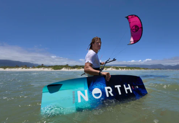 Load image into Gallery viewer, Green Hat Kiteboarding-2025 North Trace TT-Action Shot-Man Holding North Trace Board While Flying a North Kite