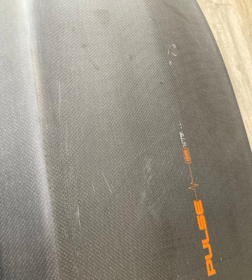 Load image into Gallery viewer, Green Hat Kiteboarding-4'6 Ozone Pulse V1 Carbon Foilboard USED-Bottom View of Scratches on a Wooden Background