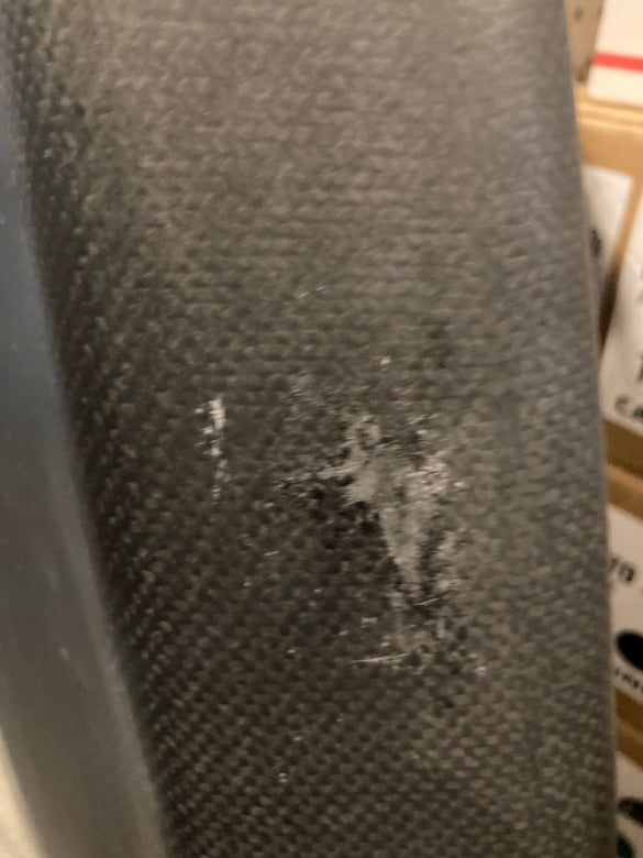 Load image into Gallery viewer, Green Hat Kiteboarding-4'6 Ozone Pulse V1 Carbon Foilboard USED-Close Up View of Edge Scrapes on a Wooden Background