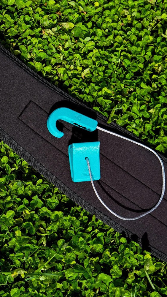 Load image into Gallery viewer, Close-up of a A3D Magnetic Hook blue tool on grass
