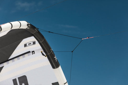 A close-up of a Core XR7 7m Kiteboarding Kite, soaring through the sky.