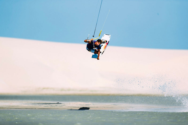 Load image into Gallery viewer, Green Hat Kiteboarding-Core Fusion 7 Kiteboard-Action Shot-Man jumping While Kiteboarding Riding a Core Fusion 7 Kiteboard