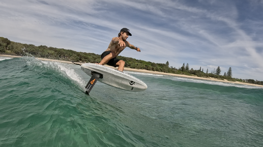 Green Hat Kiteboarding-Code Foil on Sunova Mid Pilot Foilboard-Live Shot-Man Foil Surfing a Wave