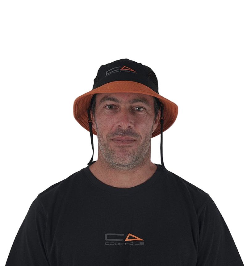 Load image into Gallery viewer, Green Hat Kiteboarding-Code Foils Bucket Hat-Man Looking into the Camera Wearing the Bucket Hat on a White Background