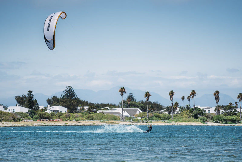 Load image into Gallery viewer, Green Hat Kiteboarding-Core Air Pro Kite-Action Shot-Woman Riding the Core Air Pro