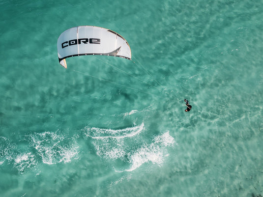 Green Hat Kiteboarding-Core Air Pro Kite-Action Shot-Man Jumping the Core Air Pro-Drone Shot