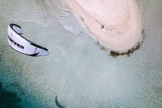 Green Hat Kiteboarding-Core AIR LW Kite-Live Shot-Core Air in the Air Above an Island