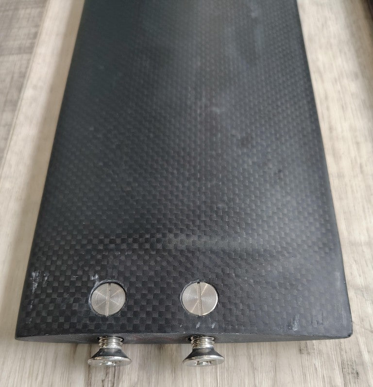 Load image into Gallery viewer, Green Hat Kiteboarding-Delta M-Frame 81cm Carbon Mast BLEM-Green Hat Kiteboarding-Delta M-Frame 81cm Carbon Mast BLEM-Top View of Bottom of Mast with Scratch and bent corner