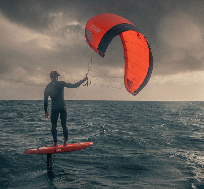 Load image into Gallery viewer, Green Hat Kiteboarding-F-One Plume-Live Shot-Man Riding an F-One Plume on a Foilboard