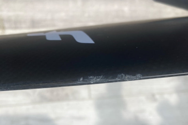 Load image into Gallery viewer, Green Hat Kiteboarding-F-One SK8 HM Carbon FW USED-Close Up View of FW Scratches