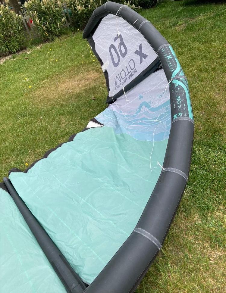 Load image into Gallery viewer, Green Hat Kiteboarding-2023 Cabrinha Moto X 9m USED Kite-Leading Edge Upside Down Left Wing Tip View