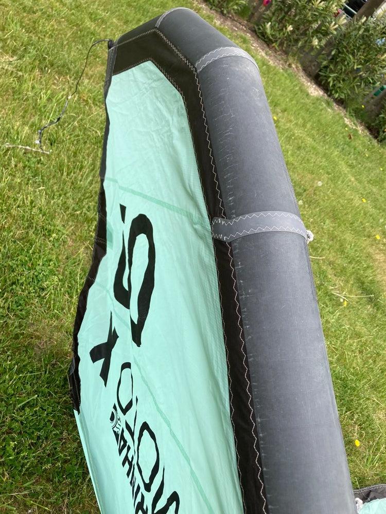 Load image into Gallery viewer, Green Hat Kiteboarding-2023 Cabrinha Moto X 9m USED Kite-Leading Edge Upside Down Left Wing Tip View