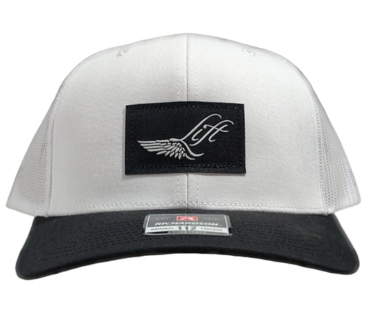 Green Hat Kiteboarding-Lift Foils Original Trucker Hat-White-Front View of  cap  on a grid background