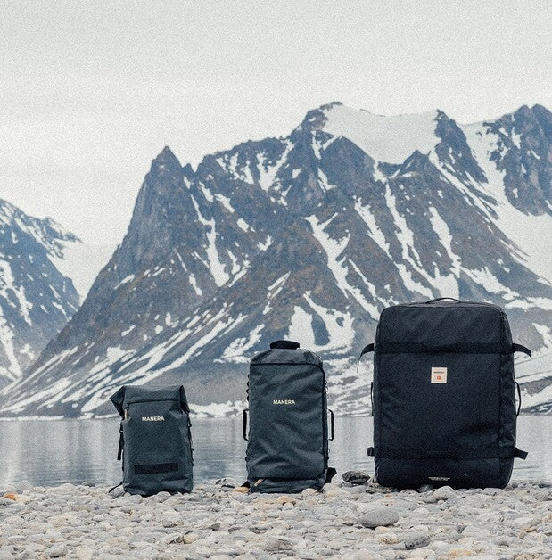 Load image into Gallery viewer, Green Hat Kiteboarding-Manera Duffle Bag 30L-Live Shot-Manera Duffle Bag Range-3 Bags on the Ground in Front of a Snowy Mountain