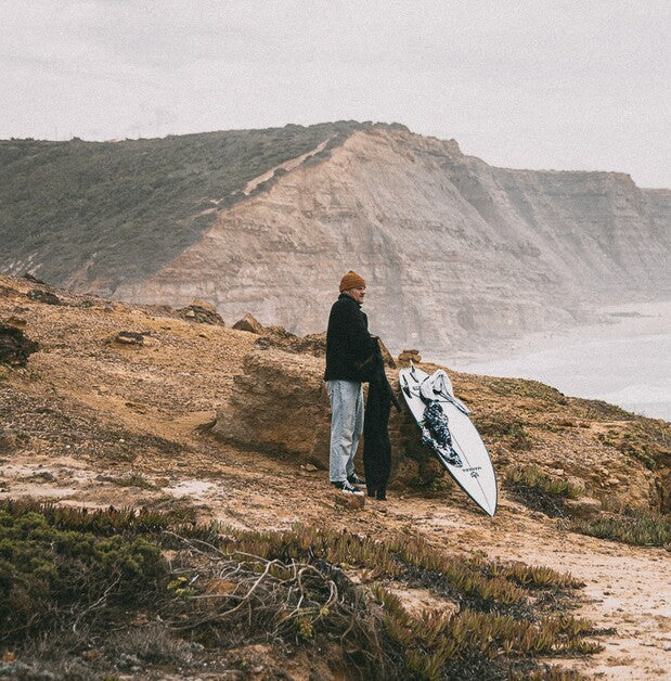 Load image into Gallery viewer, Green Hat Kiteboarding-Manera Beanie-Live Shot-Man Wearing Mango Manera Beanie