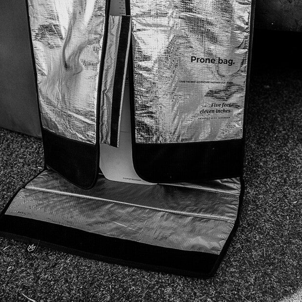 Load image into Gallery viewer, Green Hat Kiteboarding-Manera Prone Foilboard Bag-Manera Prone bag with text on a textured surface