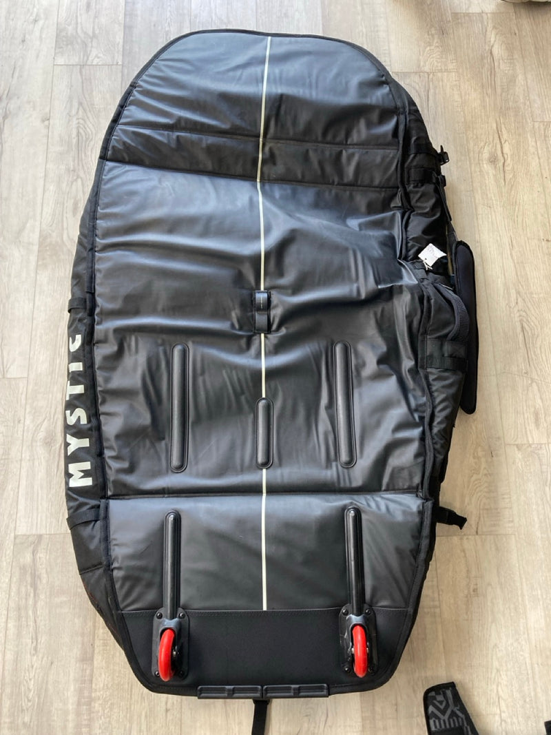 Load image into Gallery viewer, Green Hat Kiteboarding-Mystic 5'1 Saga Foil Board Bag USED-Bottom View of the Bag on a Wooden Background