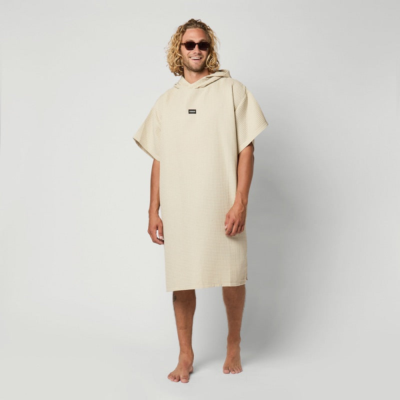 Load image into Gallery viewer, Man wearing a beige hooded towel against a plain background