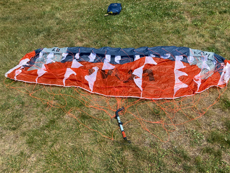 Load image into Gallery viewer, Rear bottom-side view of para wing, control bar, and lines.