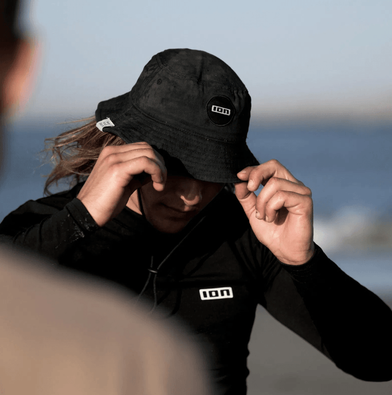 Load image into Gallery viewer, Green Hat Kiteboarding-Products-Ion Bucket hat worn by Kiter on the Beach