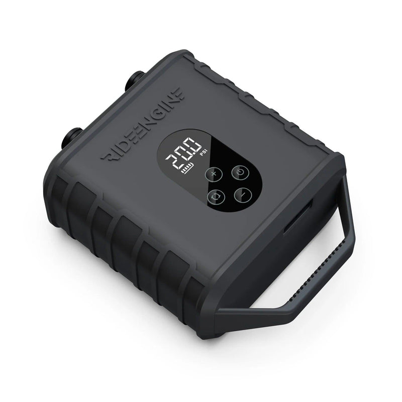Load image into Gallery viewer, A black device with buttons and a handle, the Ride Engine Air Box Electric Pump, used for inflating kites, wings, and boards. It has a powerful two-stage system for fast inflation and real-time pressure monitoring. Includes Air Box, Hose (3'), 4 Nozzles, USB-C Charging Cable, and 12V Car Charger.