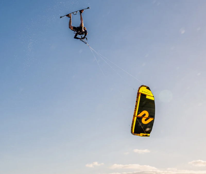 Load image into Gallery viewer, Green Hat Kiteboarding-Slingshot Code NXT-Action Shot-Man Looping Code NXT Kite