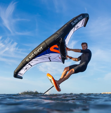 Load image into Gallery viewer, Green Hat Kiteboarding-Slingshot Wing Quickstart Package-Action Shot-Man Wing Foiling on Slingshot Foil, Board and Wing