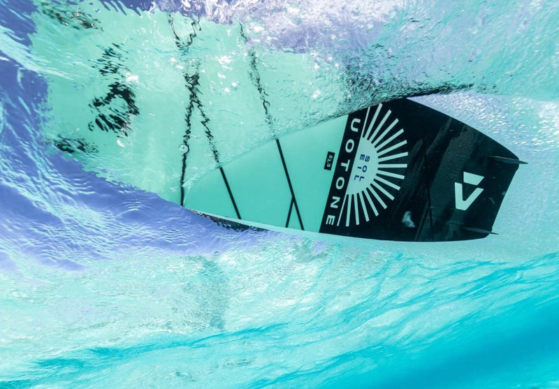 Load image into Gallery viewer, Green Hat Kiteboarding-Product-Duotone Soleil SLS Kiteboard-Live Shot-Bottom of Soleil SLS thru Clear Blue Water