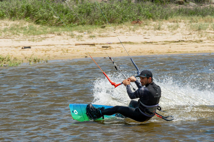 Green Hat Kiteboarding-Suit Yourself Wetsuit Program-Team Rider John Wearing an Ion Strike Wetsuit Riding Duotone Gear