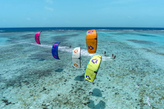 2025 Duotone Dice SLS-Live Shot-All 5 Dice Colors Kites  Flying in the Air on Crystal Blue Waters