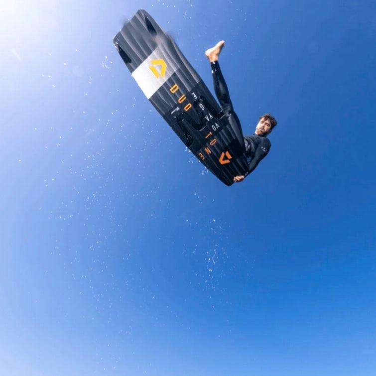 Load image into Gallery viewer, 2023 Duotone Voyage Splitboard Kiteboard-Kiter in the air doing a one-footer.