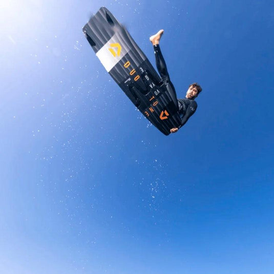 2023 Duotone Voyage Splitboard Kiteboard-Kiter in the air doing a one-footer.