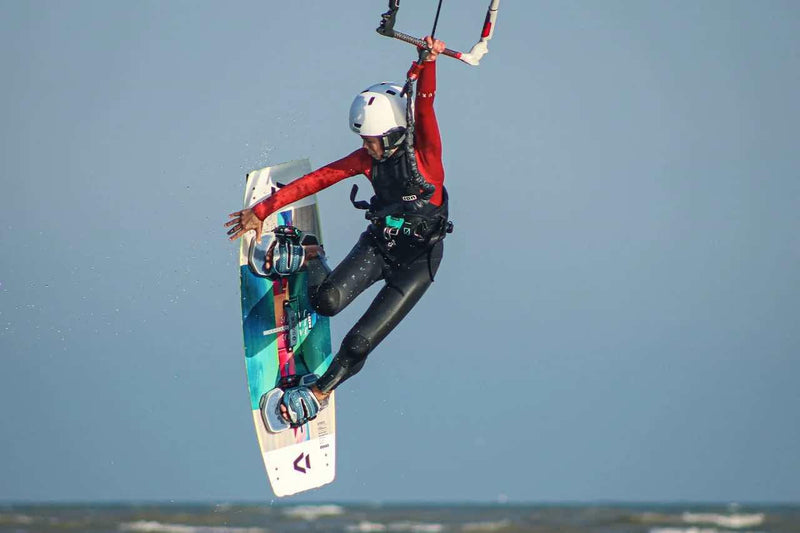 Load image into Gallery viewer, 2021 Ion Ripper Harness-Action Shot-Kid kiteboarding in the Air Wearing an ION Ripper Harness