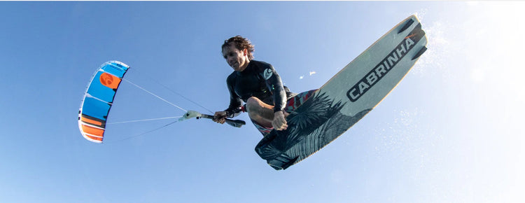 Green Hat Kiteboarding-Used Kiteboard Collection-Cabrinha Spectrum Ridden by man flying thru the air on his Cabrinha Switchblade Kite