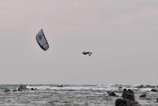 Green Hat Kiteboarding-Collection-New Arrivals: Kiteboarding-Action Shot-Man Kite Looping a North Orbit Ultra