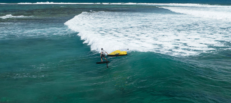 Green Hat Kiteboarding-Collections-Misc. Wingfoil Accessories-Man Surfing a Wave with an Ozone Fly Wing