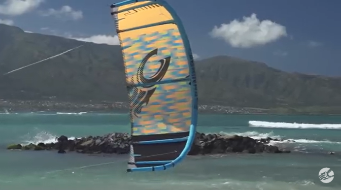 Green Hat Kiteboarding-Collection-Recent Price Drop Kiteboarding-Cabrinha Kite in the Air with a mountainous background