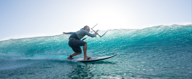 Green Hat Kiteboarding-Sunglasses-Eye Protection-Watershades Collection-White Lip Typhon Sunglasses Worn by Kitesurfer on a Wave