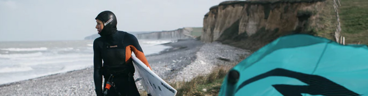 Green Hat Kiteboarding-Waterwear-Hoods and Beanies Collection-Mystic Marshall Hood Long Worn by Kiter on the Beach