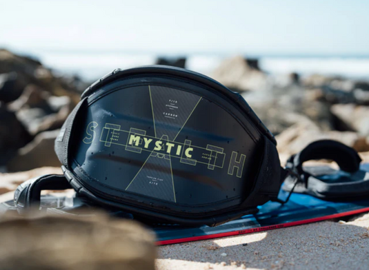 Green Hat Kiteboarding-2025 Mystic Stealth Kiteboarding Harness-Live Shot- Stealth Harness on North twintip on the Beach